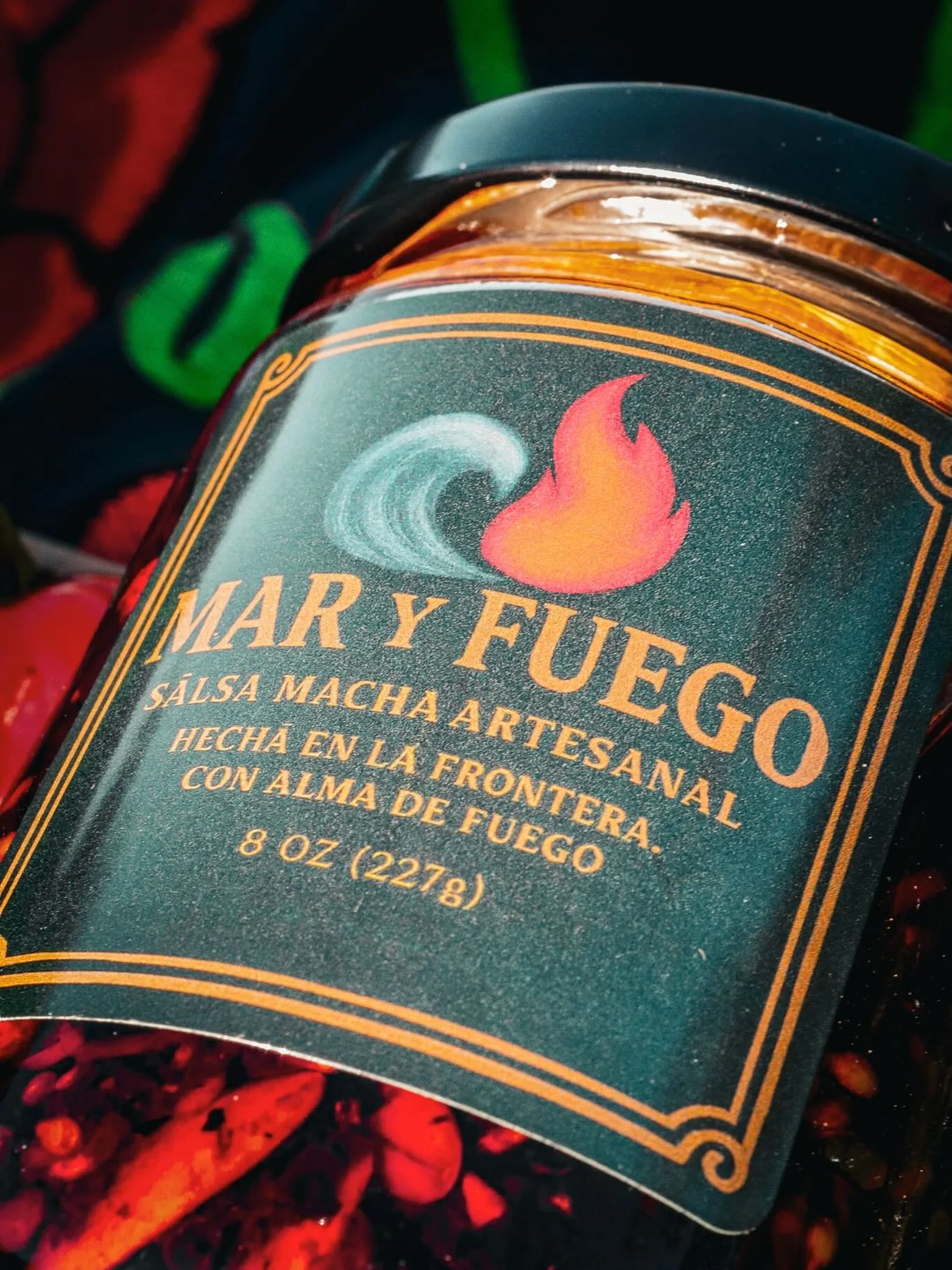 Close-up of the Mar Y Fuego salsa macha jar and its wave-and-flame label